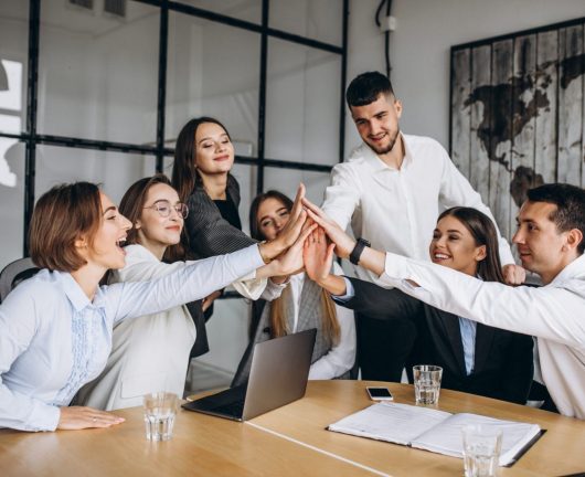 Group of people working out business plan in an office